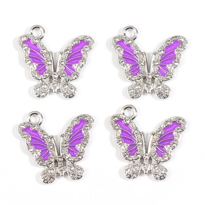 Detailed view of four purple enamel butterfly charms with white rhinestones and silver edges