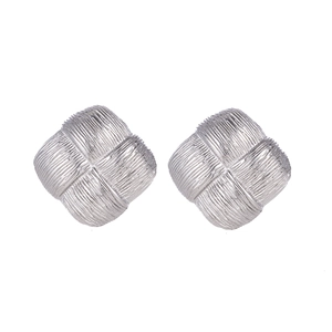Pair of silver square stud earrings with woven metal texture on a minimalist background