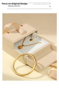 Detail of flower pendant necklace and matte gold bracelet in a luxury ribbon gift box