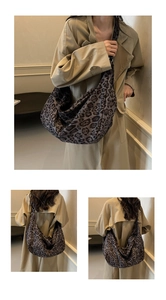 Detail view of large leopard print tote bag styled with a khaki trench coat for commuting