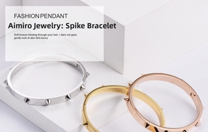 Detailed view of spiked bangles in silver, gold, and rose gold on white stones