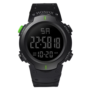 Detail view of large LCD display showing digital time and date on black sport watch