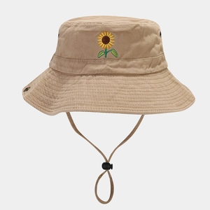 Close-up of sunflower embroidery and breathable metal eyelets on khaki cotton sun hat