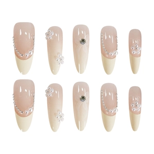 French cat-eye press-on nails with 3D pearl flowers and butterfly bow accents