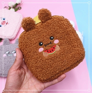 Detail of plush sanitary napkin pouch with cute bear embroidery and zipper closure