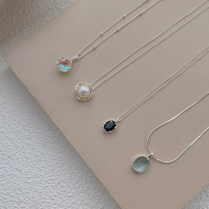 Elegant collection of four S925 sterling silver necklaces with pearl and gemstones