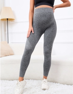 Detail of high-waist maternity leggings in dark grey with breathable knit texture