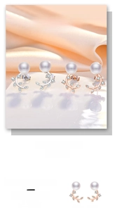 Detail of leaf-shaped pearl earrings with sparkling zircon inlay in silver and rose gold