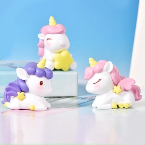 Three cute resin unicorn cake toppers for birthday party decorations and dessert tables