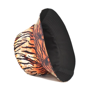 Detailed side view of bucket hat showing tiger print pattern and black inner lining