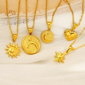 Vintage gold plated stainless steel sun and moon pendant necklaces on lace fabric