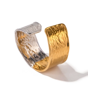 Two-tone gold and silver wide open cuff bracelet with industrial hammered texture
