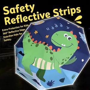 Kids navy umbrella with green dinosaur pattern and 360 degree safety reflective strip