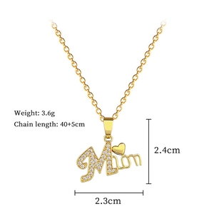 Detailed view of gold Mom pendant necklace with crystals showing dimensions and weight