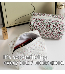 Detail of floral and polka dot quilted cotton cosmetic bags with inner lining and zipper