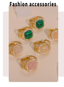 Detail of 316L titanium steel rings with green and pink square zircons on stone props