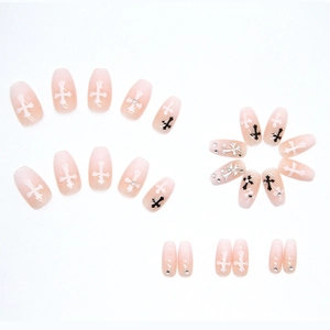 Long coffin press-on nails with nude glitter gradient and chrome cross patterns