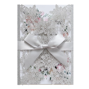 Silver glitter snowflake invitation with white floral insert and elegant grey ribbon bow
