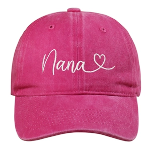 Close-up of Nana heart embroidery on distressed washed cotton pink baseball cap