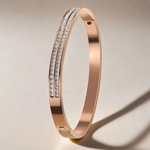 Rose gold stainless steel bracelet featuring double-row inlaid square cubic zirconia