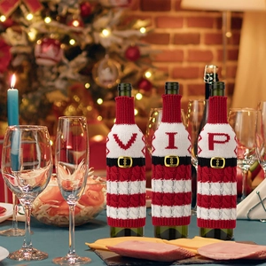 Christmas knitted wine bottle cover red stripe holiday dinner table decoration details.