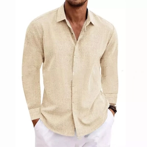 Detail view of light beige linen shirt texture with buttoned collar and long sleeves