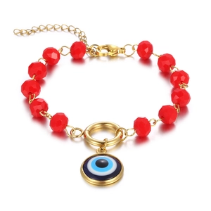 Vintage gold evil eye bracelet with red multifaceted beads and adjustable chain