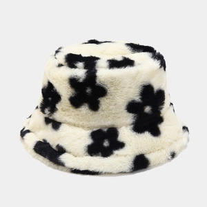 Detail of plush flower bucket hat showing thick faux fur texture and black floral pattern