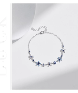 Detailed view of S925 sterling silver flower bracelet with blue and white zircons