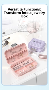 Internal view of mini suitcase jewelry box with pink multi-grid storage and ring slots