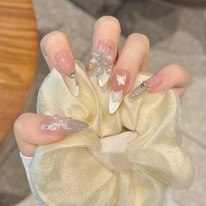Handcrafted pearl cat eye press-on nails with 3D butterfly design and crystal accents