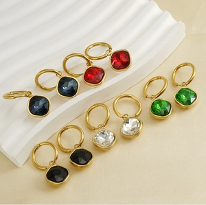 Detailed close-up of 18K gold-plated geometric earrings with colorful square zircons