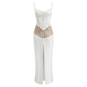Close-up of white satin dress featuring lace patchwork and corset-style bust details
