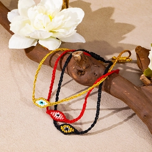 Bracelets Evil Eye tissés à la main en noir, rouge et jaune avec cordon réglable