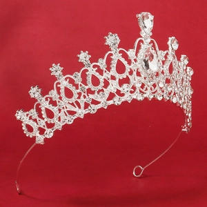 Close-up of bridal crown featuring silver alloy base with intricate crystal rhinestones
