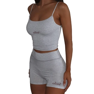 Detailed view of the Outcast print on a grey ribbed cotton two-piece crop top and shorts set