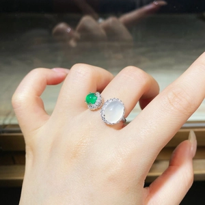 Detail of adjustable silver ring featuring green chalcedony and white oval agate stones