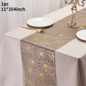 Detail of grey Halloween table runner with golden spider web pattern and 11x354 inch size