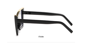 Side view detail of black cat-eye glasses with elegant gold metal accents on temples