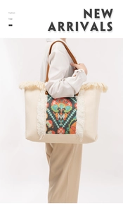 Close-up of bohemian tassel canvas tote bag with ethnic print and leather handle