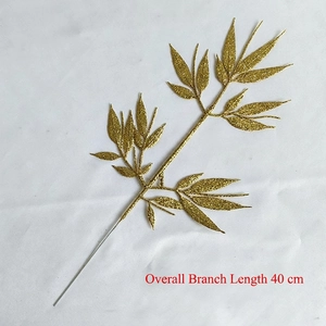 Detail of 40cm artificial golden glitter branch with leaf clusters for festive decor