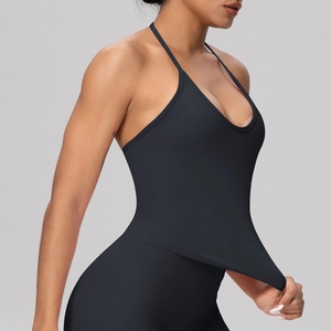 Close-up of black racerback yoga tank top showing elastic quick-dry fabric texture