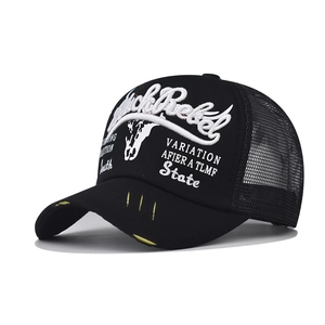 Detail of distressed baseball cap featuring yellow frayed brim and white rebel embroidery