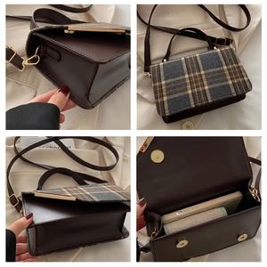 Detail view of vintage plaid patchwork handbag showing inner space and leather finish