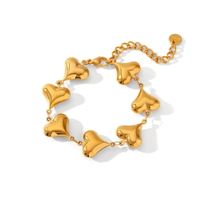 Detailed view of 18K gold-plated stainless steel bracelet with multiple heart pendants