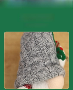 Detail of grey cable-knit gnome hat with festive red and green felt ornaments