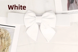 Close-up of white elastic wide corset belt featuring a large decorative bow tie