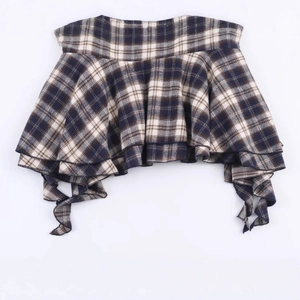 Plaid layered fashion top in navy blue and beige classic patterns shown in a flat lay view