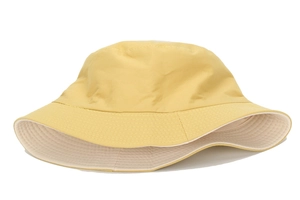 Detail of ginger yellow bucket hat with reinforced stitching and dual-tone cotton fabric
