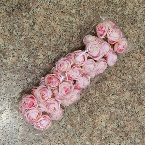 Detail of DIY artificial pink rose flower heads made of high quality silk and plastic